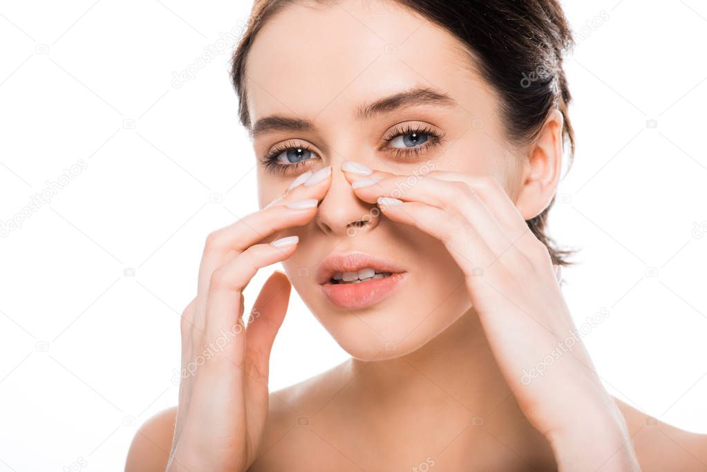 beautiful nude woman touching nose after rhinoplasty and looking at camera isolated on white 