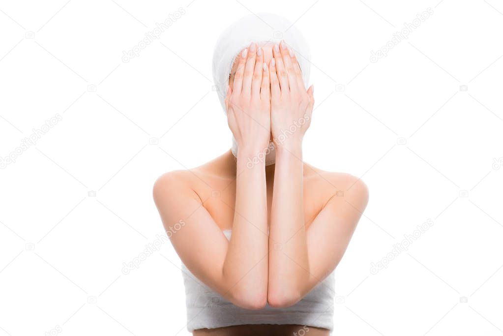 woman with bandaged head covering face with hands isolated on white   