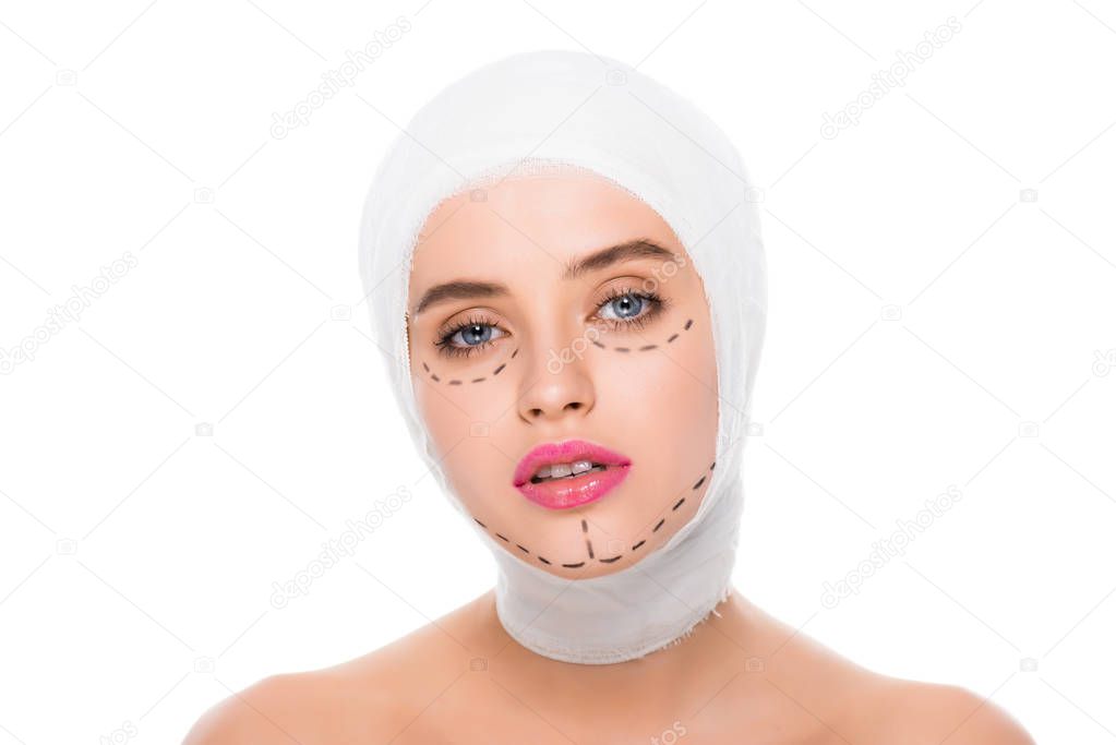 nude young woman with bandaged head and marks on face isolated on white 