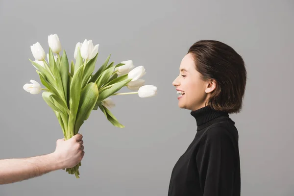 Cropped View Man Holding White Tulips Cheerful Woman Isolated Grey — Stock Photo, Image
