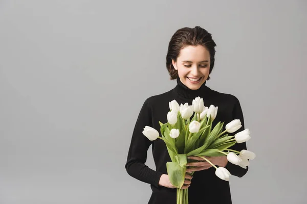 Cheerful Brunette Woman Looking Flowers Smiling Isolated Grey — Stock Photo, Image
