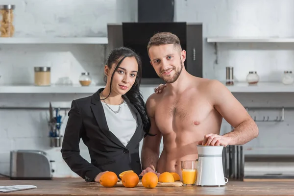 Happy Shirtless Man Preparing Orange Juice Attractive Girl — Stock Photo, Image
