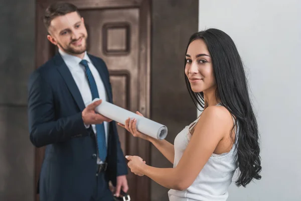 Selective Focus Attractive Brunette Girl Giving Paper Roll Man Suit — Stock Photo, Image