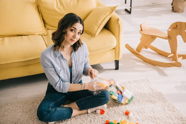 Woman Toy Blocks Sitting Crossed Legs Carpet — 스톡 사진