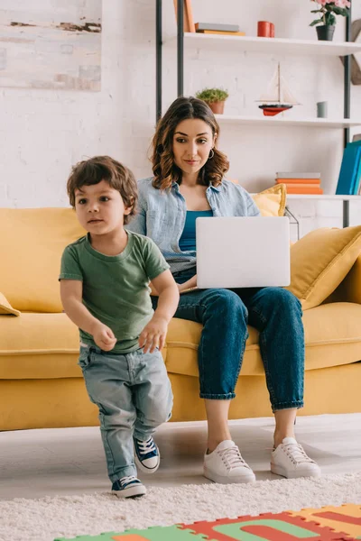 Pretty Woman Using Laptop Looking Little Son — Stock Photo, Image