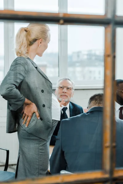 Selective Focus Blonde Business Coach Standing Looking Multicultural Coworkers — Stock Photo, Image