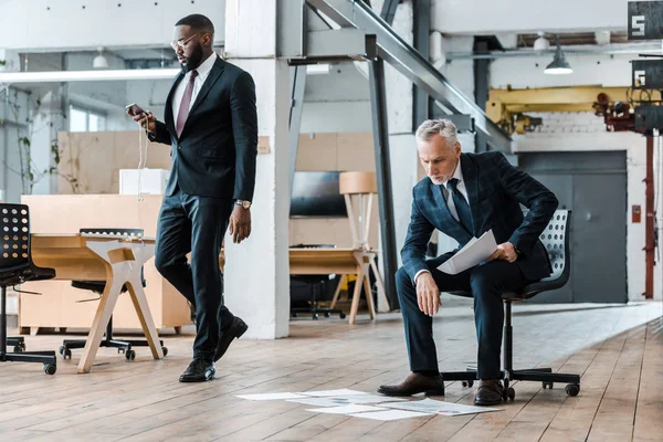 Pensive Businessman Sitting Chair Looking Charts Graphs African American Man — Stock Photo, Image