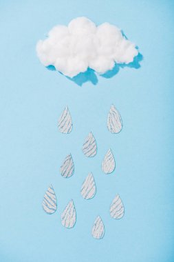 top view of cotton candy cloud with glitter raindrops on blue clipart