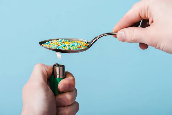 Cropped View Man Lighting Metal Spoon Colorful Sprinkles Isolated Blue — Stock Photo, Image