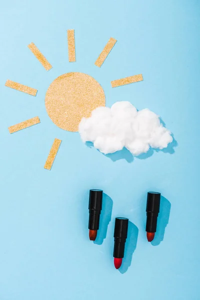 Top View Paper Sun Cotton Candy Cloud Lipstick Raindrops Blue — Stock Photo, Image