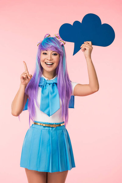 Excited asian anime girl holding blue thought bubble and showing idea sign on pink
