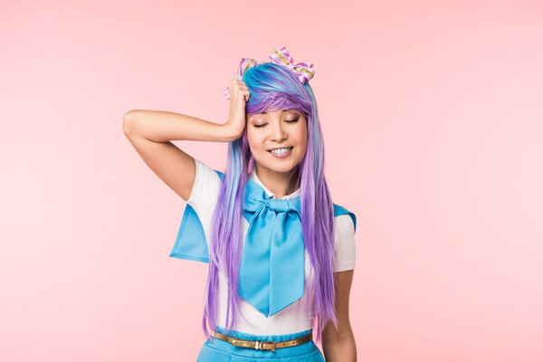 Smiling anime girl in purple wig with closed eyes on pink