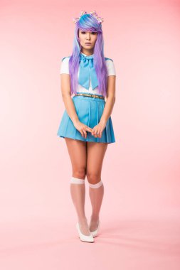Full length view of sad asian anime girl in skirt standing on pink clipart