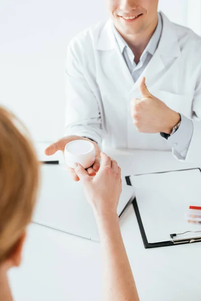 Cropped View Cheerful Doctor Giving Face Cream Patient Showing Thumb — Stock Photo, Image