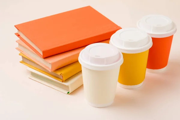 Stack Books Colorful Disposable Cups Light Surface — Stock Photo, Image