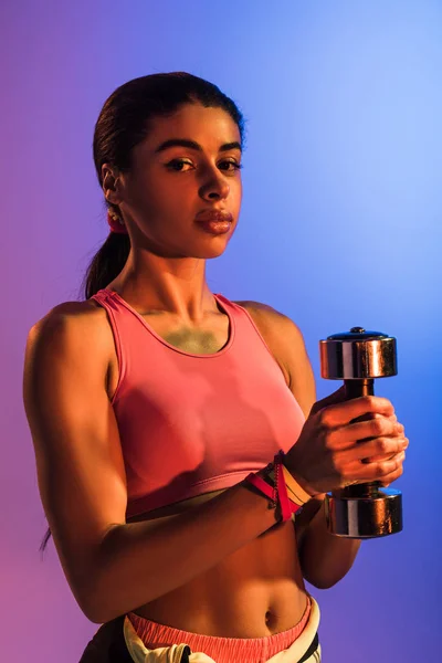 Sportive African American Girl Holding Dumbbell Looking Camera Purple Blue — Stock Photo, Image