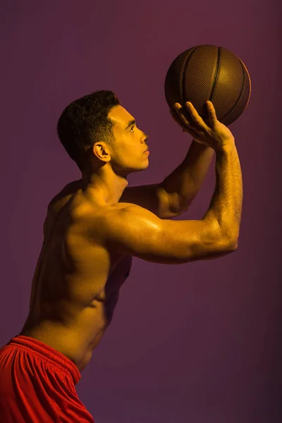 Handsome Sportive Mixed Race Man Playing Ball Purple Background — Stock Photo, Image