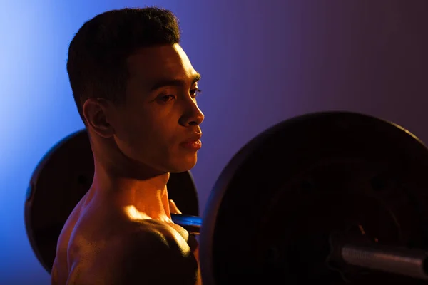 Handsome Mixed Race Man Holding Barbell Blue Dark Purple Gradient — Stock Photo, Image