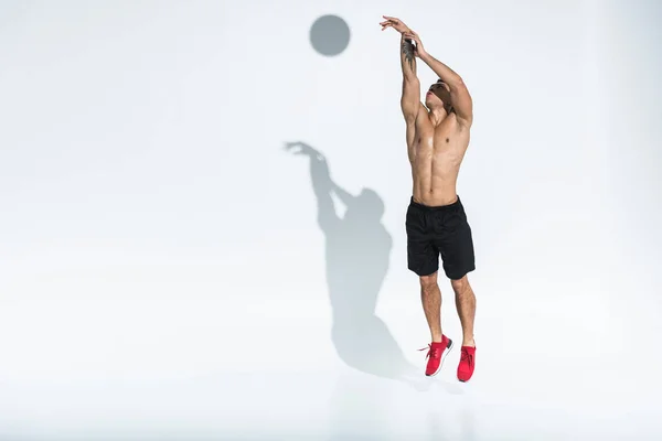 Athletic Mixed Race Man Black Shorts Red Sneakers Jumping White — Stock Photo, Image