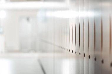 selective focus of lockers in corridor in university clipart