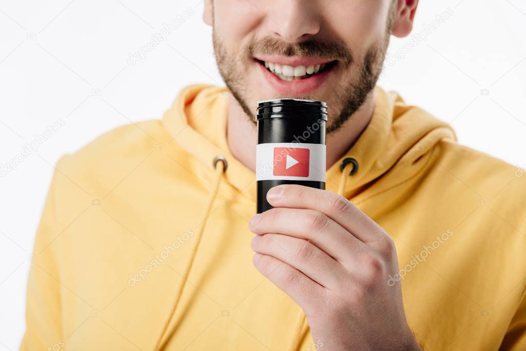 Cropped view of man holding container with youtube logo isolated on white