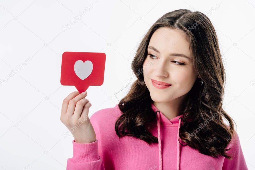 beautiful young girl holding red paper cut card with heart symbol isolated on white