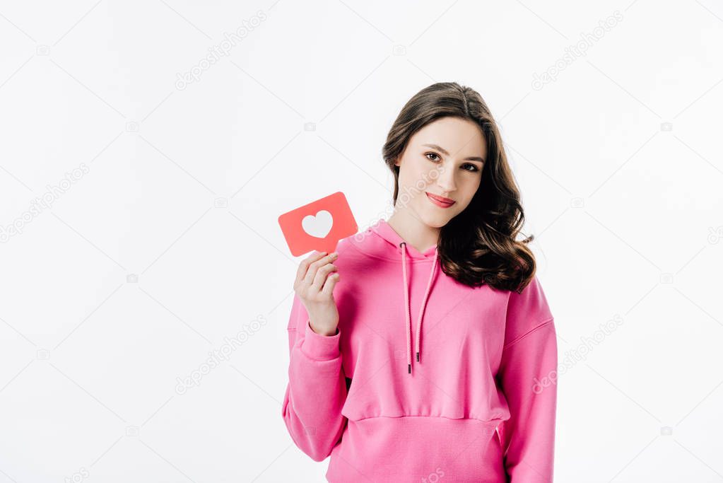 attractive young woman holding red paper cut card with heart symbol isolated on white
