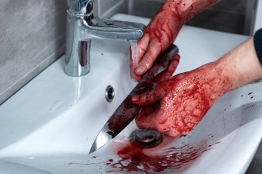 cropped view of killer washing knife in sink after murder clipart
