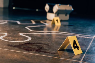 chalk outline, blood stain, investigation kit and evidence markers at crime scene clipart