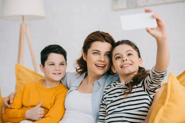 Cheerful Child Taking Selfie Smiling Mother Brother While Sitting Sofa — Stock Photo, Image