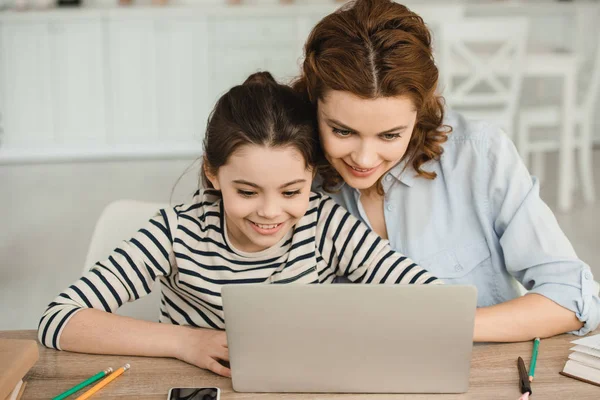 Cheerful Mother Daughter Using Laptop Together While Doing Schoolwork Home — Stock Photo, Image