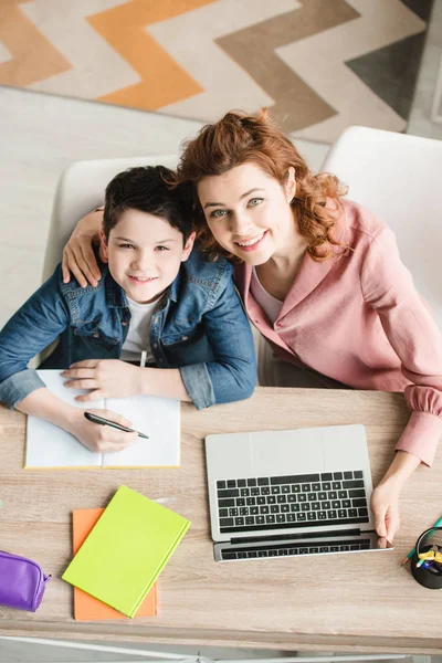 Top View Happy Mother Hugging Adorable Son While Sitting Table — Stock Photo, Image