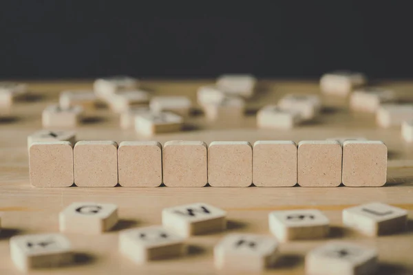 Selective Focus Eight Empty Cubes Surrounded Blocks Letters Wooden Surface — Stock Photo, Image