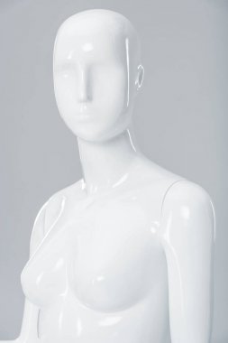 white plastic mannequin figure isolated on grey  clipart