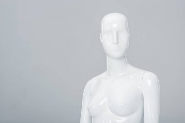 white plastic mannequin figure isolated on grey with copy space clipart