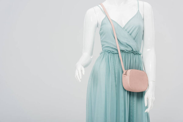mannequin with bag and dress isolated on grey with copy space