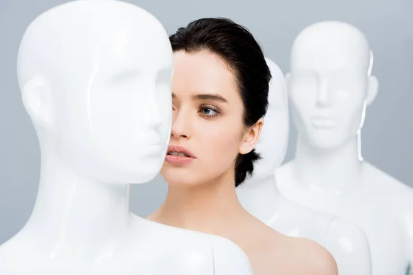 Beautiful Girl Posing Row Mannequins Isolated Grey — Stock Photo, Image