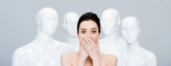 Panoramic Shot Girl Covering Mouth While Posing Mannequins Isolated Grey — Stock Photo, Image