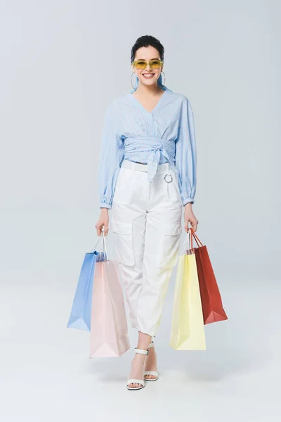 Beautiful Smiling Girl Shopping Bags Looking Camera Grey — Stock Photo, Image