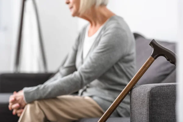 Cropped View Senior Woman Wooden Cane Foreground — Stock Photo, Image