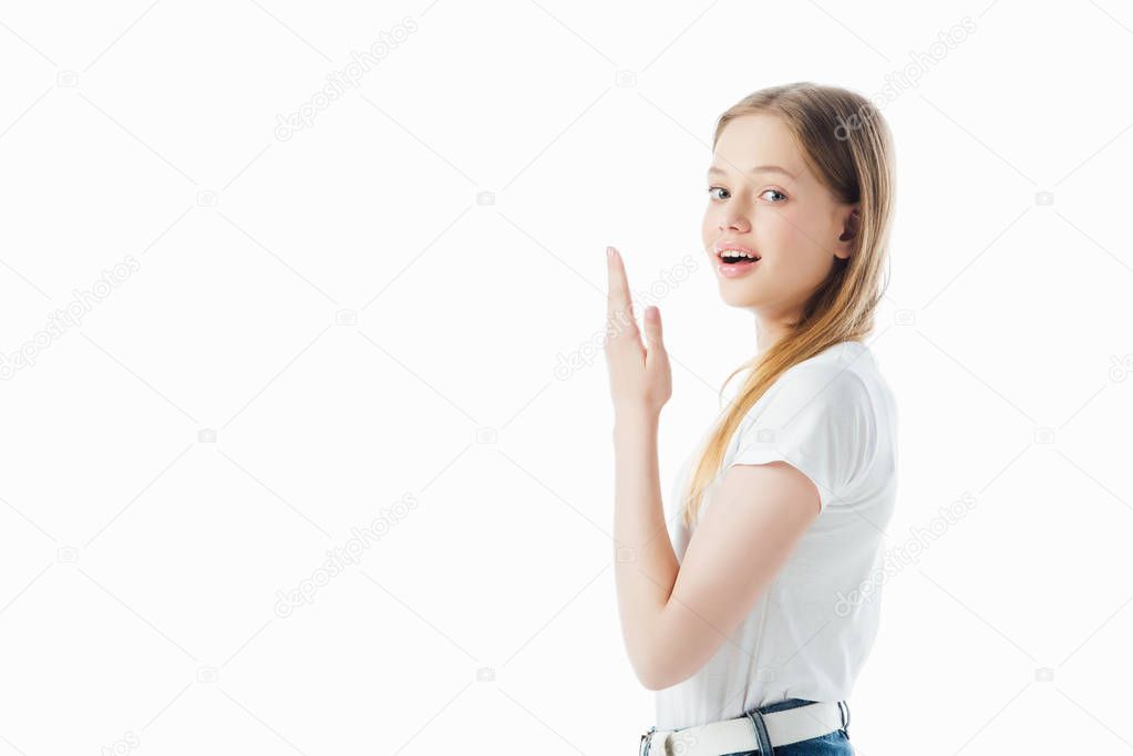 happy teenage girl with raised hand looking at camera isolated on white