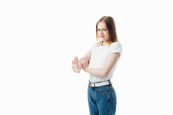 confused teenage girl showing stop gesture isolated on white