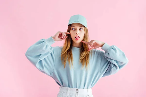 Pretty Teenage Girl Cap Sticking Out Tongue Isolated Pink — Stock Photo, Image