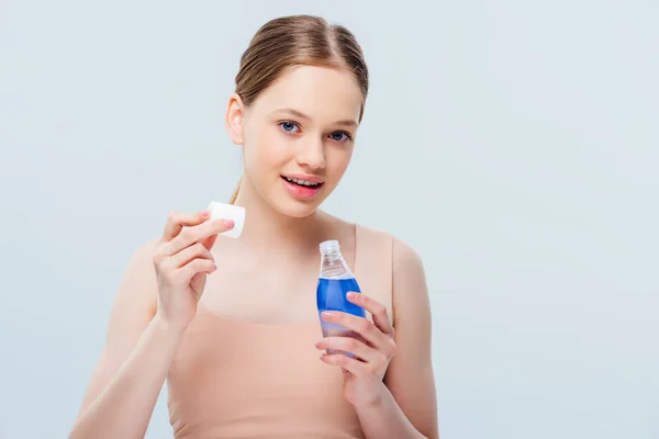 Pretty Teenage Girl Holding Cosmetic Lotion Isolated Grey — Stock Photo, Image