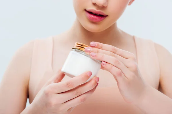 Vista Cortada Menina Adolescente Segurando Creme Cosmético Mãos Isoladas Cinza — Fotografia de Stock