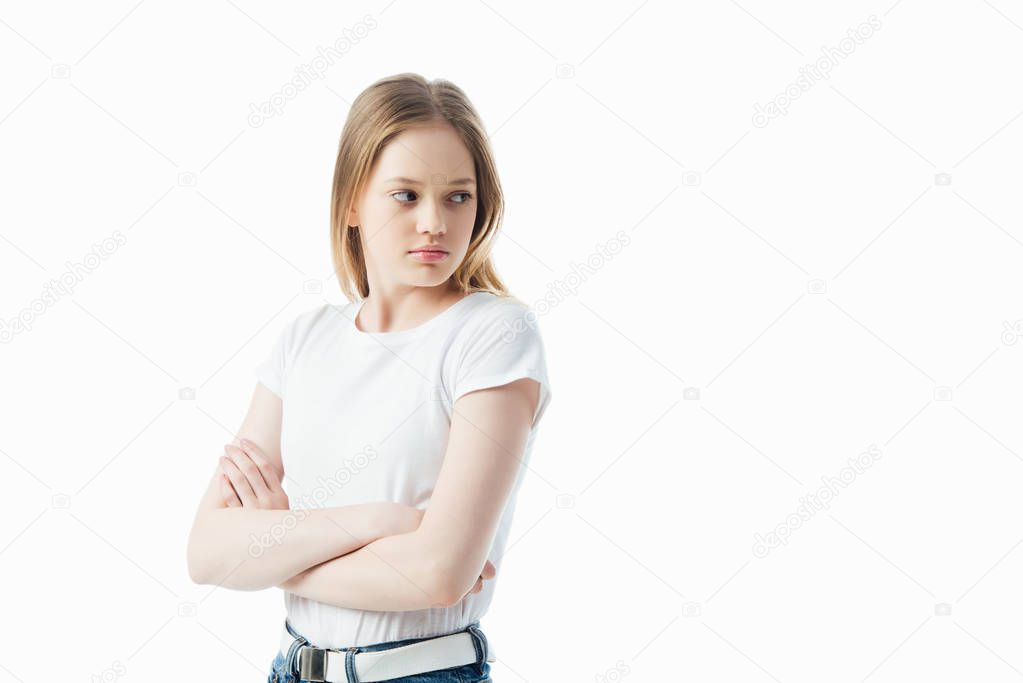 offended teenage girl with crossed arms looking away isolated on white