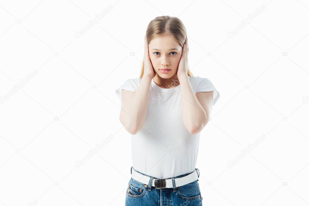 scared teenage girl covering ears with hands isolated on white