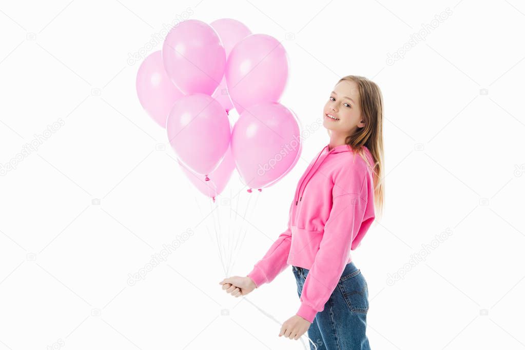 happy teenage girl with pink balloons looking at camera isolated on white