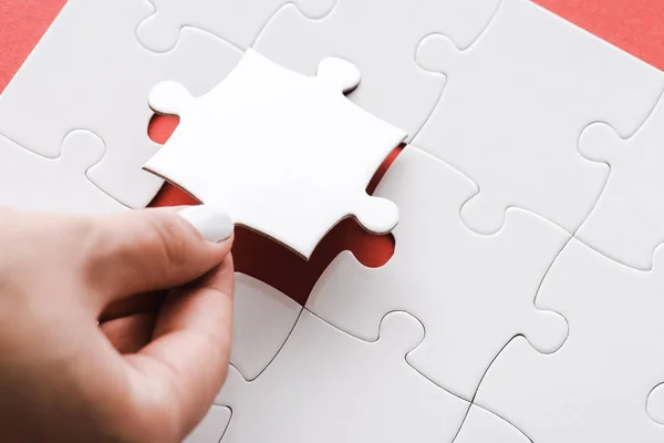 Cropped View Woman Holding White Jigsaw Puzzle Piece Red — Stock Photo, Image