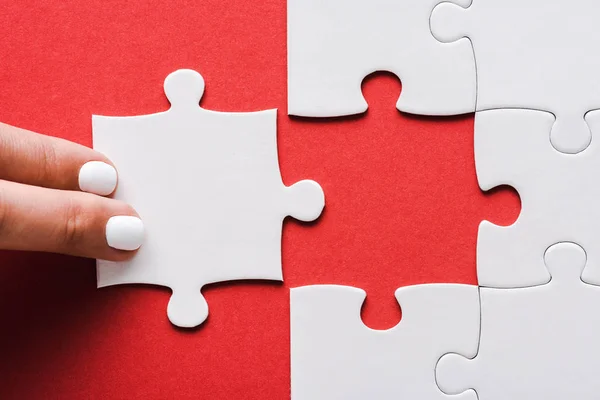 Cropped Woman Touching Jigsaw Connected White Puzzle Pieces Red — Stock Photo, Image